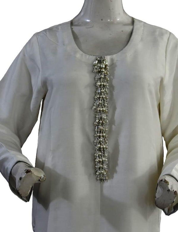 White Silk Suit with Pearl Buttons